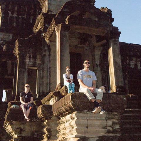 students visiting ruins in Asia